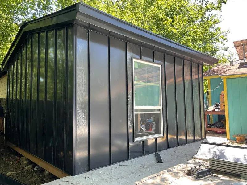 Black standing seam metal wall panels for Roof Inspection in Orlovista